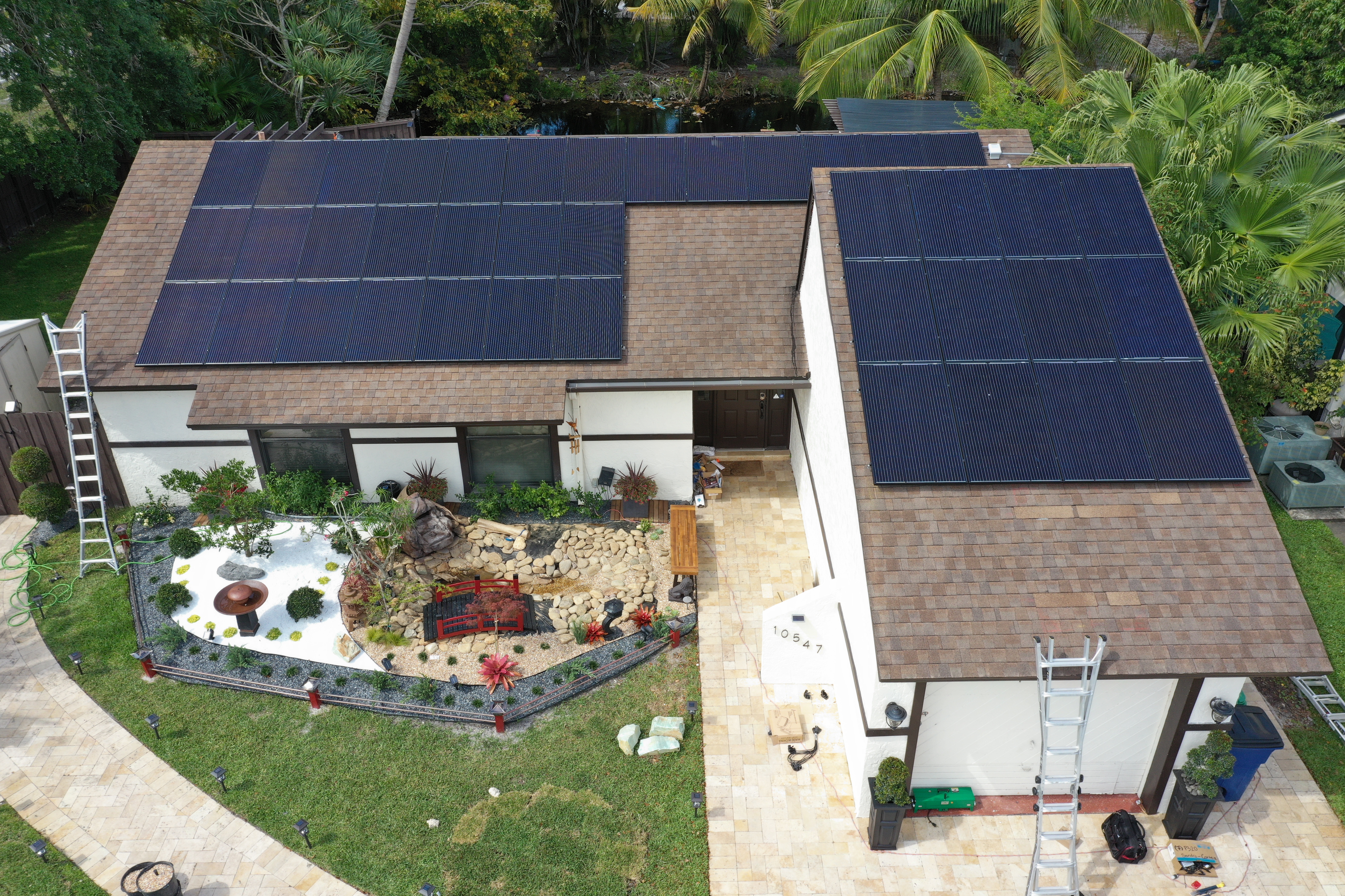 Aerial view of house with solar panels